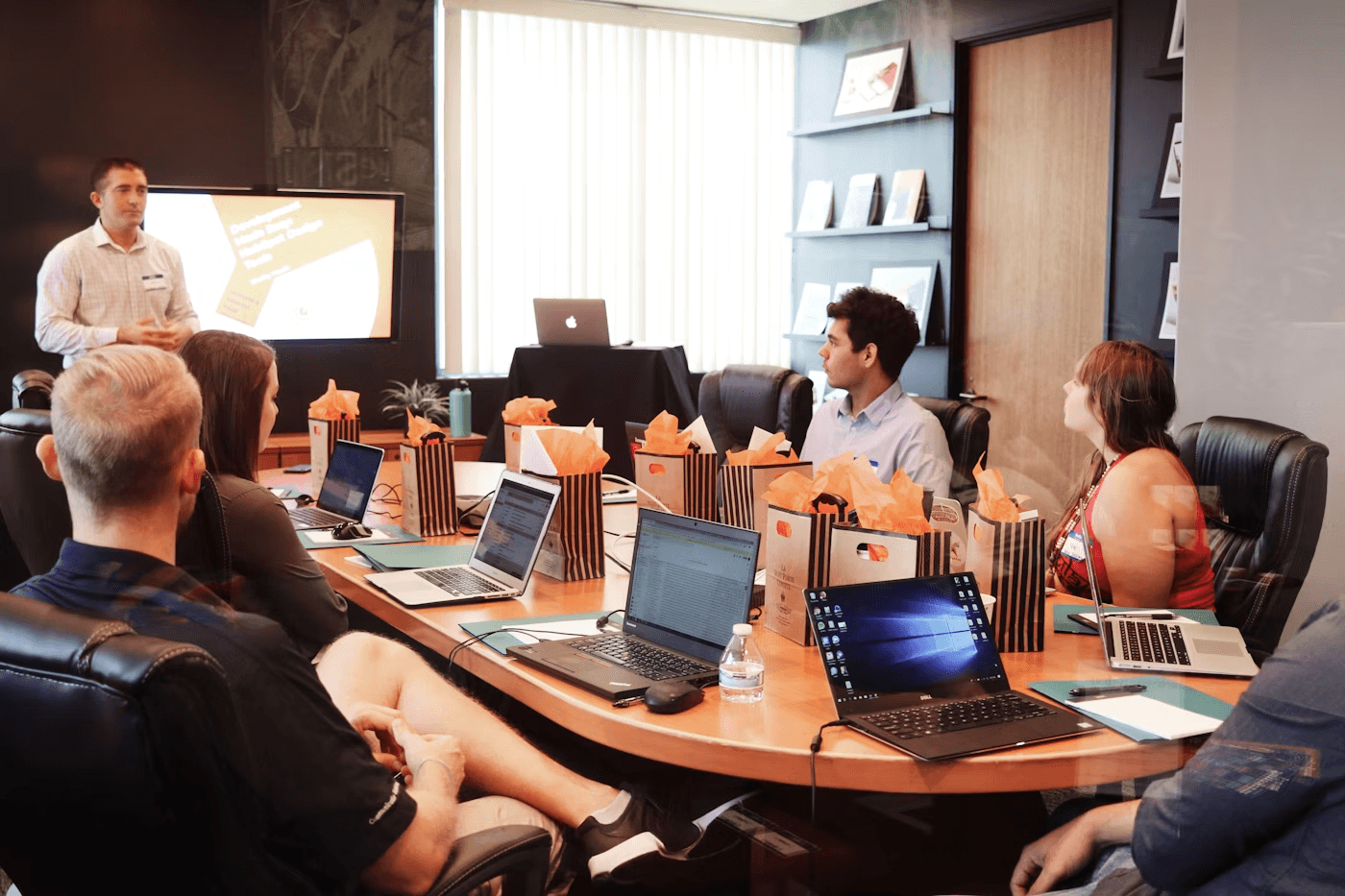 A professional business meeting where people discuss direction and decisions